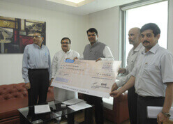 Divd Cheque handover to CM.jpg